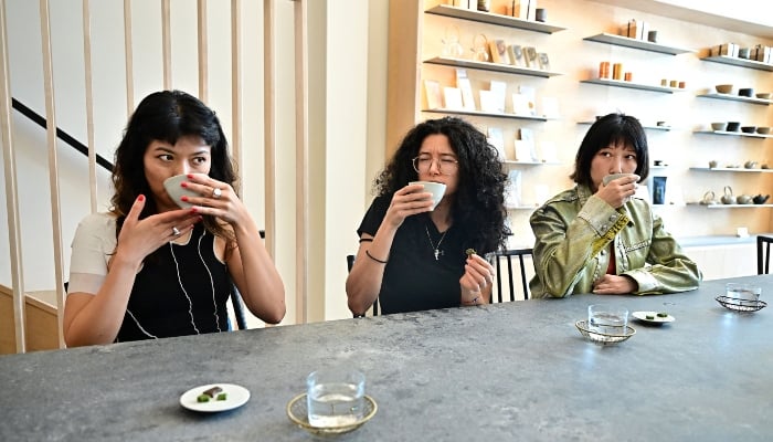 Emily Harwitz, Stevie Youssef and Kate Harwitz sip their matcha beverages at Kettl Tea in the Los Feliz neighborhood of Los Angeles, California, US, on May 20, 2025. — AFP