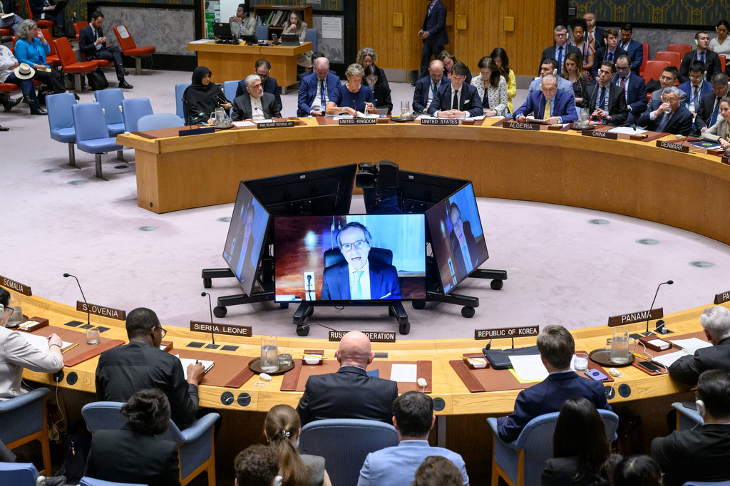 Rafael Grossi (on screen), Director General of the International Atomic Energy Agency (IAEA), briefs the UN Security Council meeting on Iran.