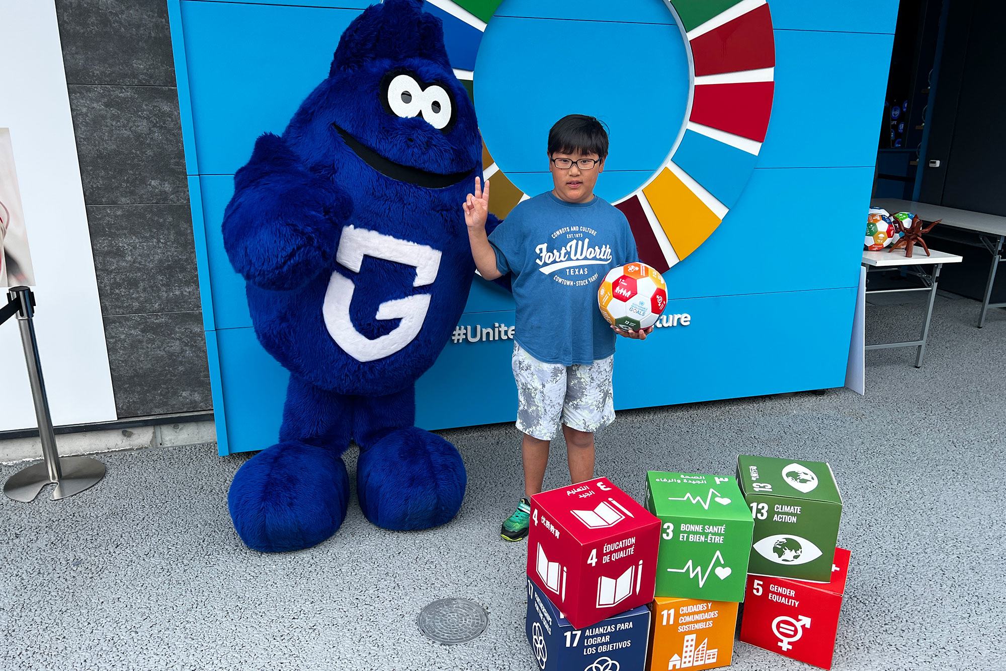 A boy participates in an event at the UN pavilion to promote the SDGs.