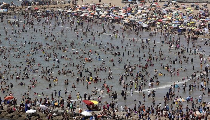 People cool off at a beach during a heatwave in Rabat, Morocco, on June 29, 2025. — AFP