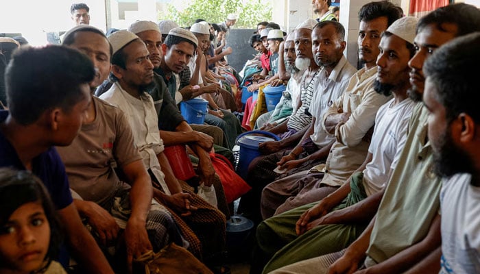 Rohingya refugees wait at the World Food Programme(WFP) distribution centre to purchase grocery items, at the refugee camp in Coxs Bazar, Bangladesh, March 15, 2025. — Reuters