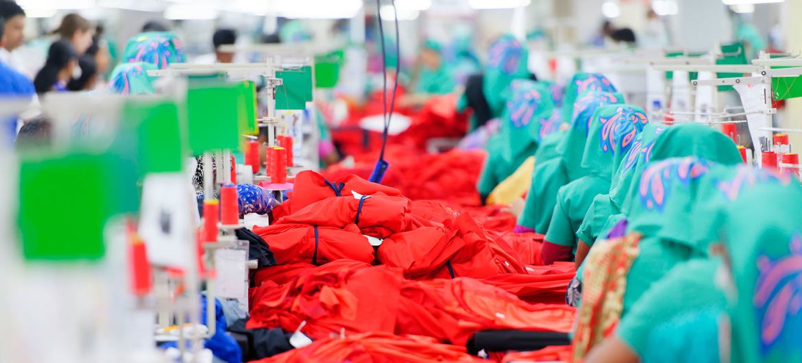 Garment employees work on a production line of an exporting clothing plant in Jordan.