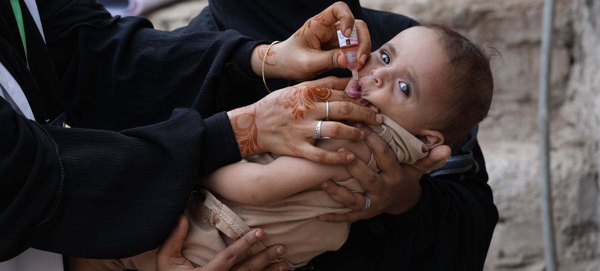 A child receives a polio vaccination in Yemen.