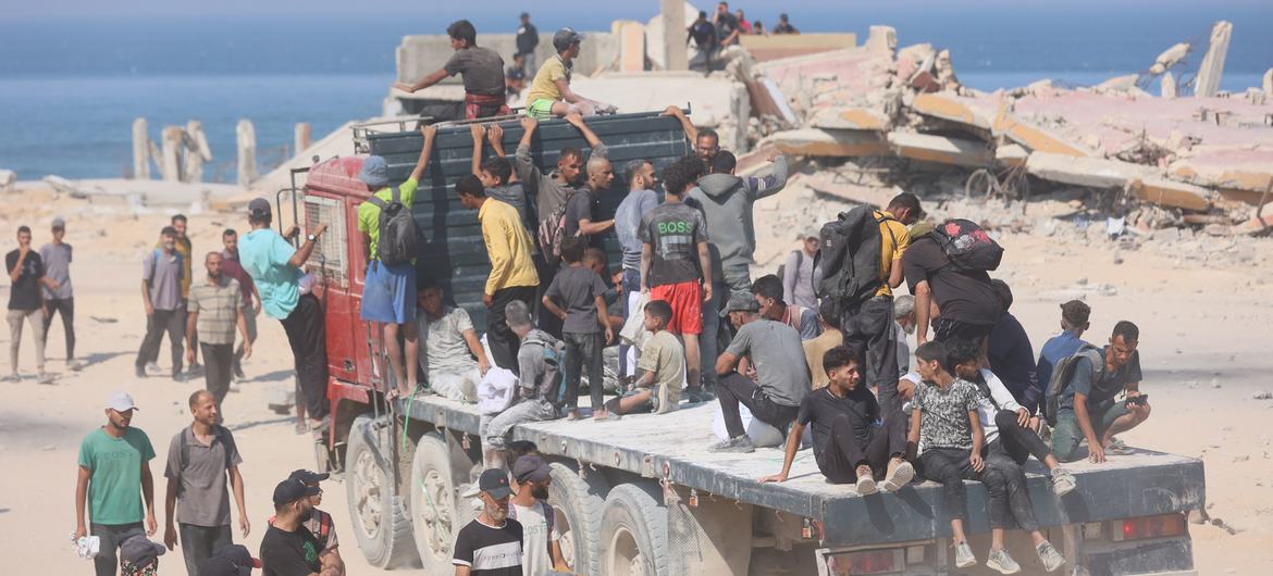 Gazans head towards a food aid distribution point. The entire population of over two million people in the war-torn Strip is severely food insecure.
