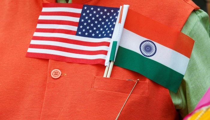 An attendee wears US and Indian flags on their chest as people gather on the South Lawn of the White House to watch an official State Arrival ceremony where US President Joe Biden is welcoming India’s Prime Minister Narendra Modi for a State Visit at the White House in Washington, US, June 22, 2023. — Reuters
