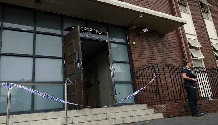 A policewoman stands guard at the scene of a fire at the Adass Israel Synagogue in Ripponlea, Melbourne, Australia, December 6, 2024. — Reuters