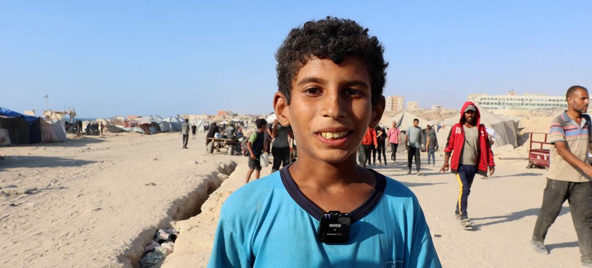 Mohammed Mudeiris, a child who lost his father in an Israeli airstrike, coming to secure food for his siblings from aid trucks arriving via the Zikim crossing.