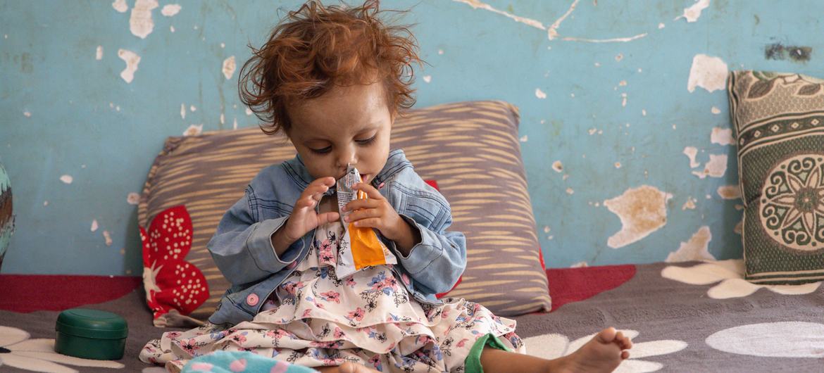 A toddler eats a food supplement, as part of WFP's nutrition programme, in Mokha, Taiz, in Yemen.