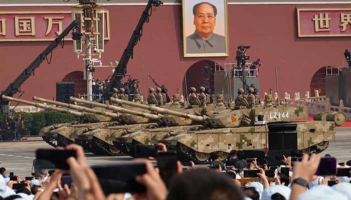 Members of the Peoples Liberation Army Ground Assault Force stand on armoured vehicles during a military parade to mark the 80th anniversary of the end of World War Two, in Beijing, China, September 3, 2025. — Reuters