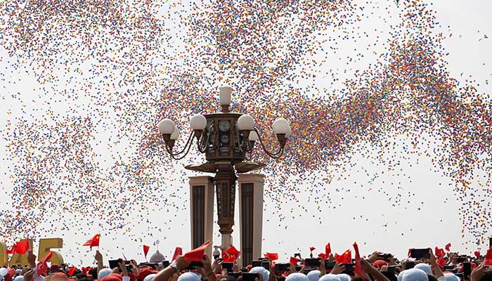 Balloons are released during a military parade to mark the 80th anniversary of the end of World War Two, in Beijing, China, September 3, 2025. — Reuters