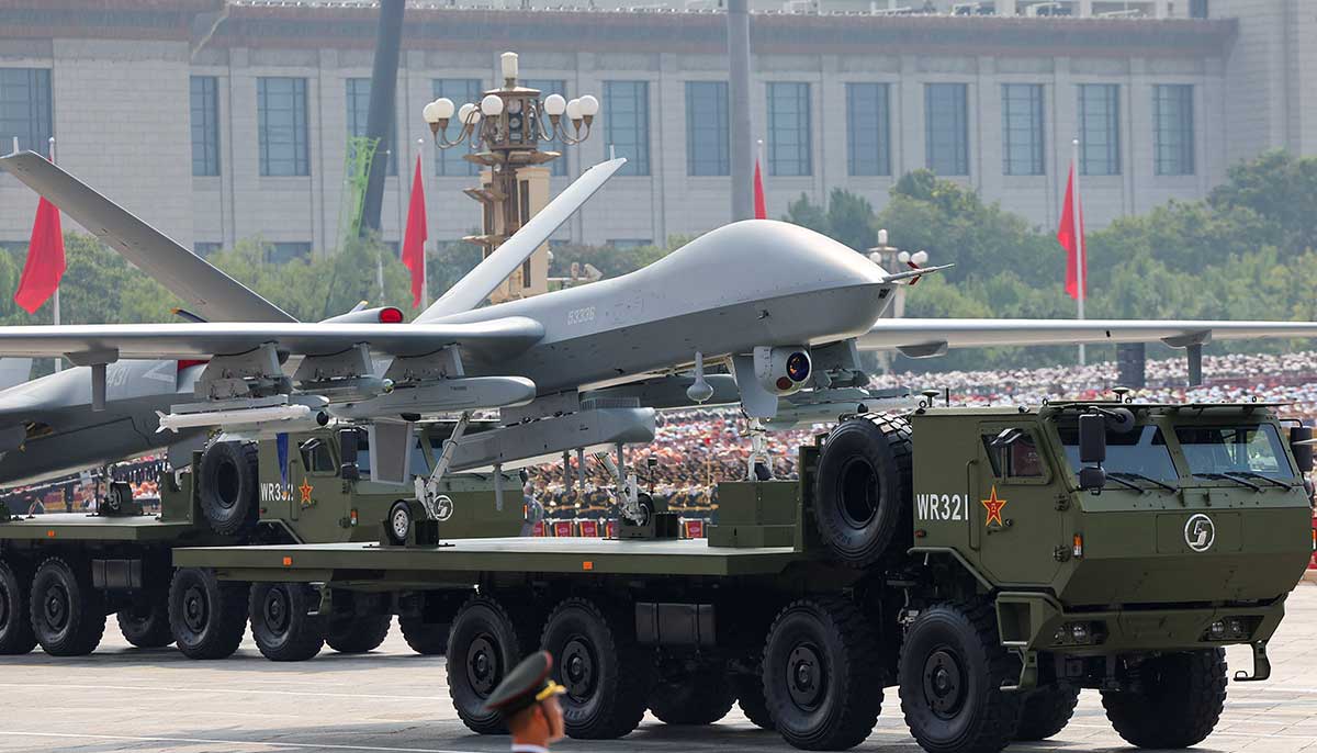 A member of the Peoples Liberation Army stands as unmanned aerial vehicles are displayed during a military parade to mark the 80th anniversary of the end of World War II, in Beijing, China, September 3, 2025. — Reuters