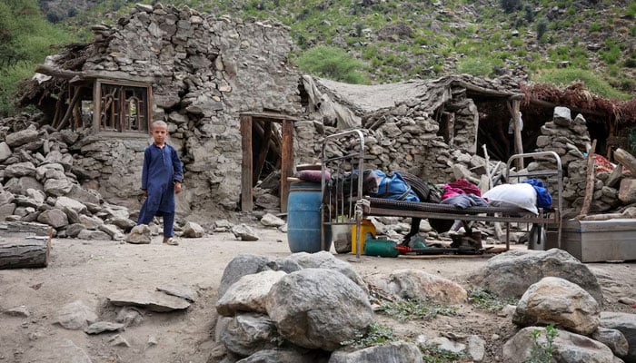 A boy stands in front of a house after a deadly magnitude-6 earthquake that struck Afghanistan on Sunday, at Lulam village, in Nurgal district, Kunar province, Afghanistan, September 3, 2025. — Reuters
