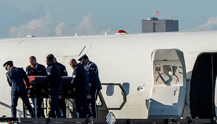 The body of slain conservative activist Charlie Kirk is carried from Air Force Two, accompanied by US Vice President JD Vance, (not pictured) as the aircraft lands at the airport in Phoenix, Arizona, US on September 11, 2025. — Reuters