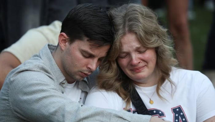 People react during a vigil at Orem City Center Park, after US right-wing activist and commentator, Charlie Kirk was fatally shot during an event at Utah Valley University, in Orem, Utah, US. September 11, 2025. — Reuters
