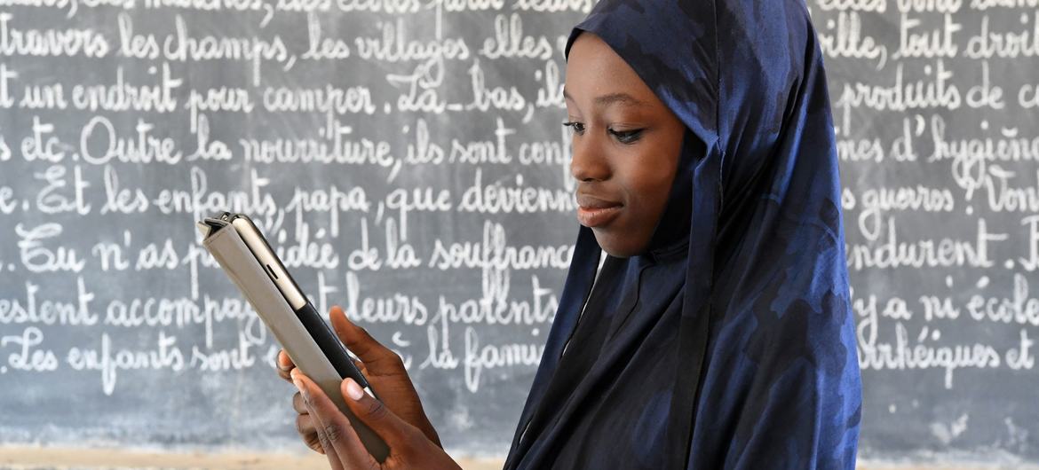 A girl uses a tablet during class at her school in Safi, South Niger.