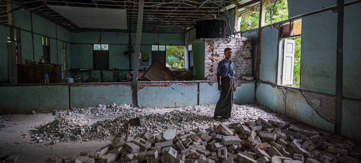 In Mandalay, a teacher stands amid the ruins of his former classroom, destroyed by the March 2025 earthquakes that deepened civilian suffering across Myanmar.