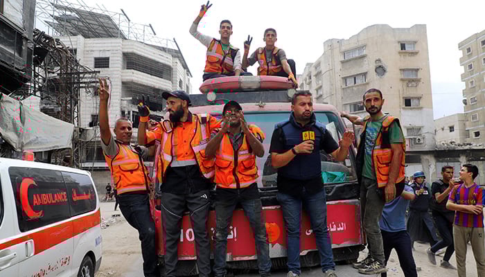 Palestinian emergency personnel celebrate, after U.S. President Donald Trump announced that Israel and Hamas agreed on the first phase of a Gaza ceasefire, in Gaza City, October 9, 2025. — Reuters