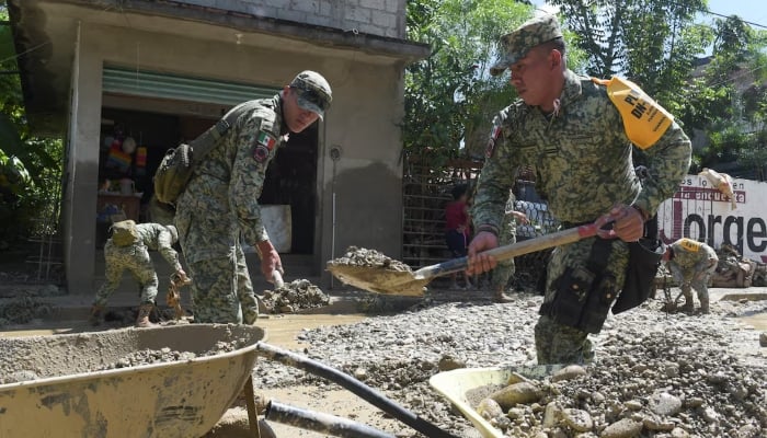 Members of the army remove mud and rocks from a street after torrential rains that overflowed rivers, causing flooding in Alamos, Veracruz state, Mexico October 12, 2025. — Reuters