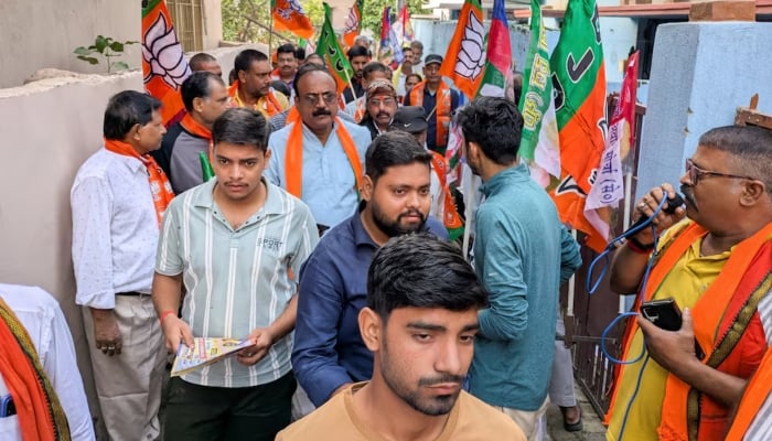People take part in a voting campaign for a local Bharatiya Janata Party (BJP) candidate, held in the Deegha area of Patna, India, October 12, 2025. — Reuters