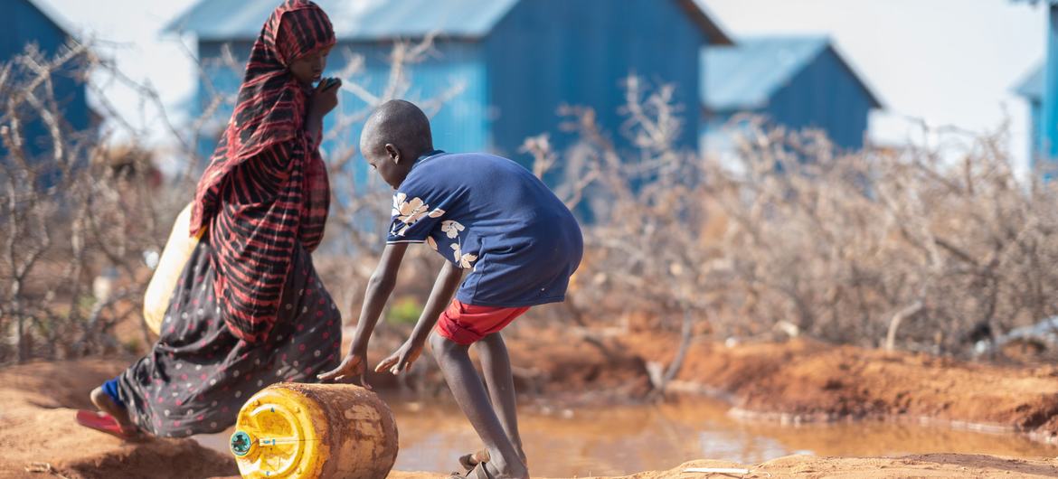 A boy rolls a water container in Dollow on the Somali border with Ethiopia.