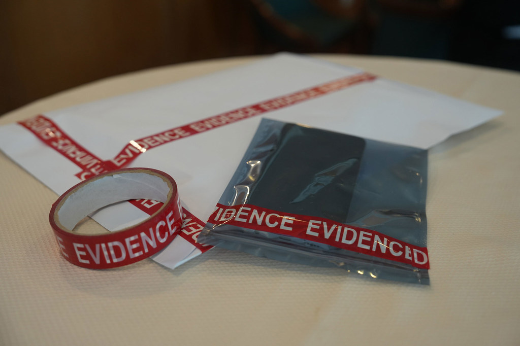 A mobile phone, evidence in an anti-cybercrime operation in Southeast Asia, is set aside for analysis.