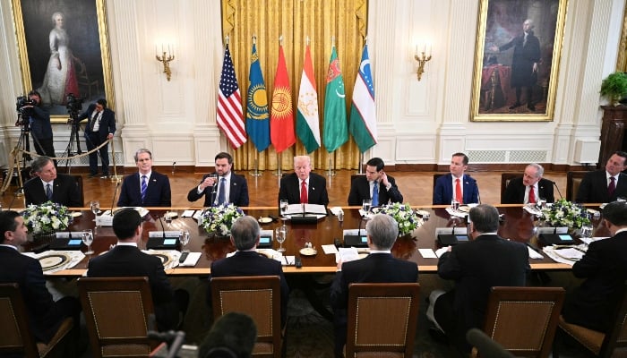 US President Donald Trump (C) flanked by US Vice President JD Vance (L) and US Secretary of State Marco Rubio (R) attend a dinner with Central Asian leaders in the East Room of the White House in Washington, DC, on November 6, 2025. — AFP