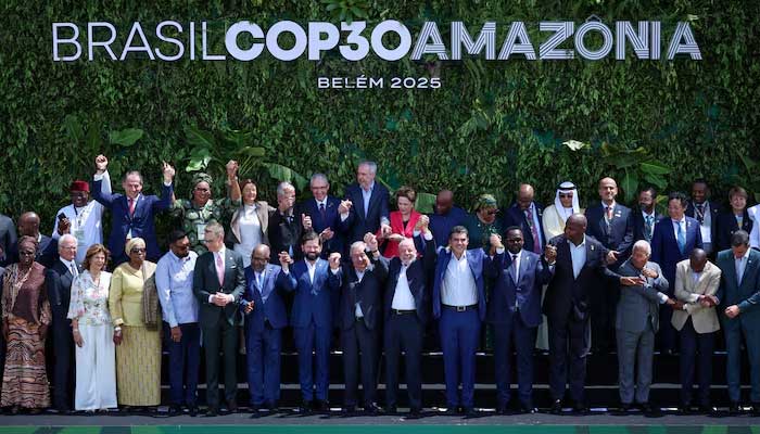 Brazils President Luiz Inacio Lula da Silva, United Nations Secretary-General Antonio Guterres and other delegates attending the Belem Climate Summit ahead of the United Nations Climate Change Conference (COP30) raise hands a during a group photo, in Belem, Brazil, November 7, 2025. — Reuters