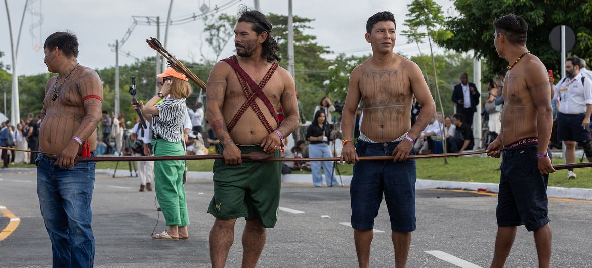 Indigenous Peoples block an entrance to the UN Climate Conference in Belém, Brazil. 