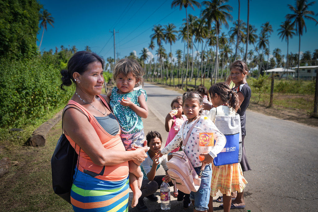 Warao families make their way to the local church in Icacos, Trinidad and Tobago for cash distribution.
