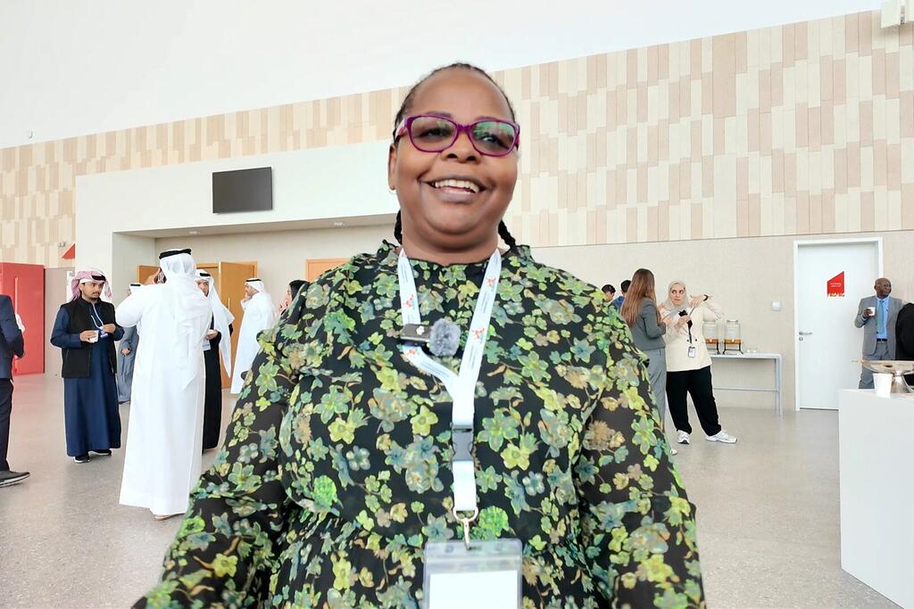 Dr. Roselyn Musaruru-Wacharewa, a Zimbabwean entrepreneur, smiles at a professional event in Bahrain during WEIF 2026, showcasing her experience with international business platforms.